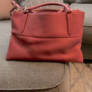 Beautiful pink Coach pocketbook. It’s from the Rogue collection.